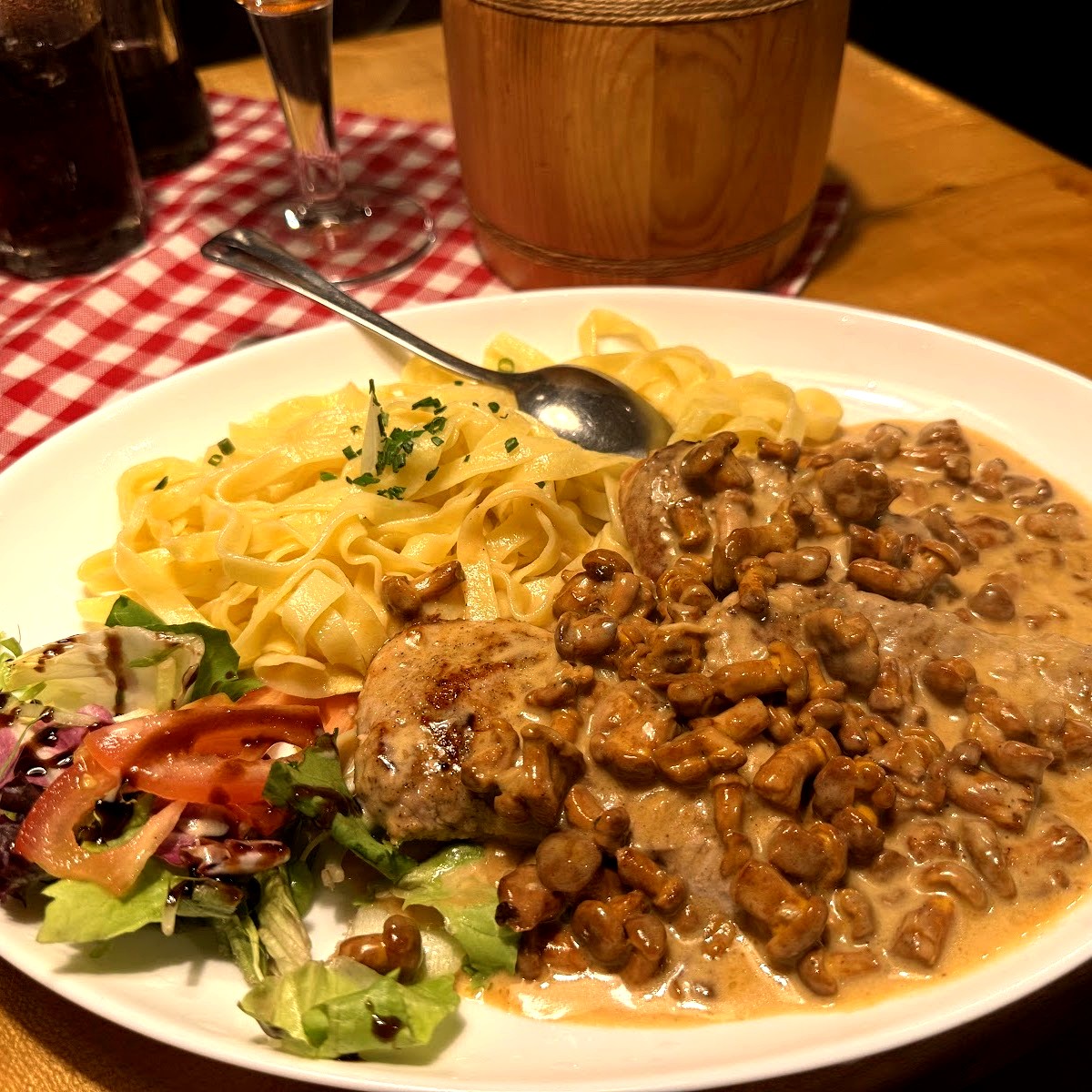 Creamy mushroom schnitzel with pasta and salad