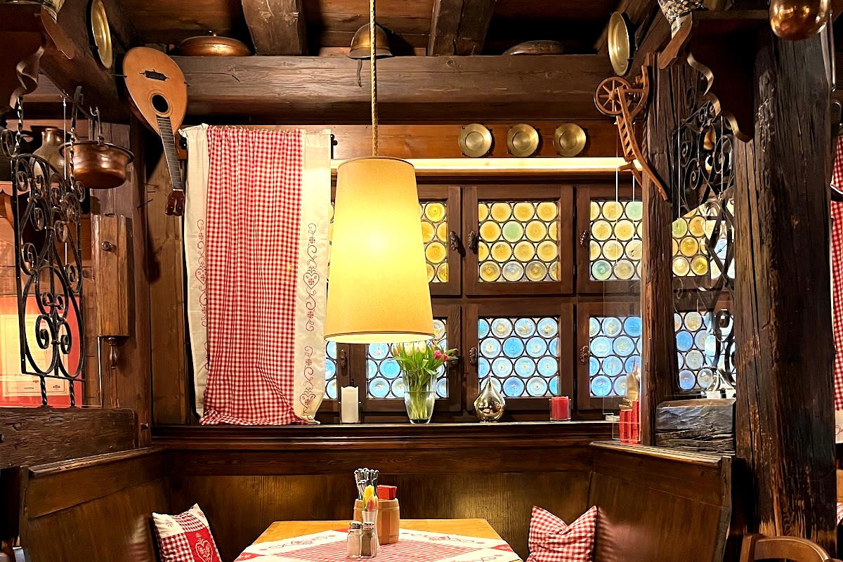 A warm wooden dining booth inside Zum Floessla